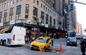 Taxi Stuck In Hole - NYC