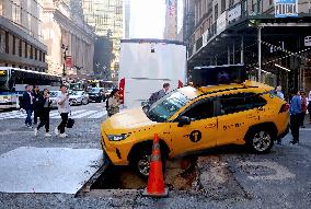 Taxi Stuck In Hole - NYC