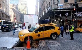 Taxi Stuck In Hole - NYC