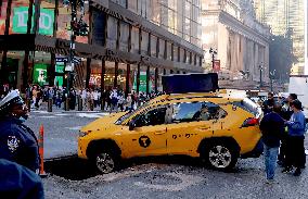 Taxi Stuck In Hole - NYC