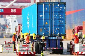 Ship Load And Unload Cargo at Qingdao Port in Shandong