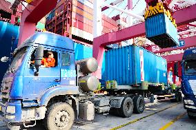 Ship Load And Unload Cargo at Qingdao Port in Shandong