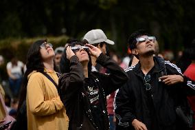 Persons Observe Annular Solar Eclipse From Mexico