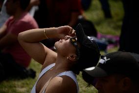 Persons Observe Annular Solar Eclipse From Mexico