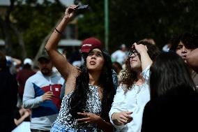 Persons Observe Annular Solar Eclipse From Mexico