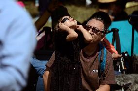 Persons Observe Annular Solar Eclipse From Mexico