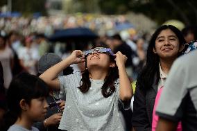 Persons Observe Annular Solar Eclipse From Mexico