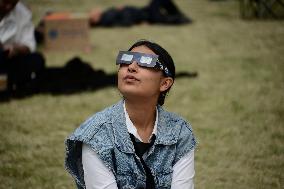 Persons Observe Annular Solar Eclipse From Mexico