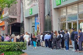 People line up outside the visa office of the U.S. consulate in Shanghai