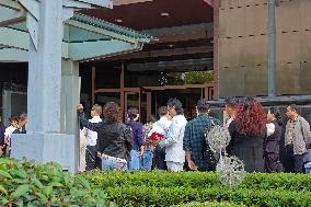 People line up outside the visa office of the U.S. consulate in Shanghai