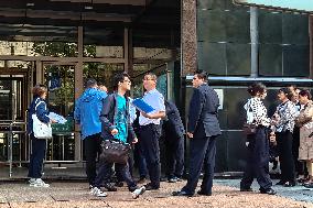 People line up outside the visa office of the U.S. consulate in Shanghai