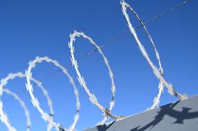Barbed Wire Protects Medical Clinic Building