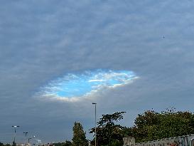 A Rare Cloud Hole Seen In Paris Sky