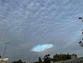 A Rare Cloud Hole Seen In Paris Sky