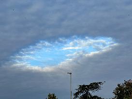 A Rare Cloud Hole Seen In Paris Sky