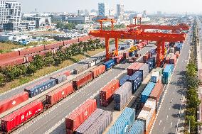 Workers Load Containers onto Vehicles in Nanjing