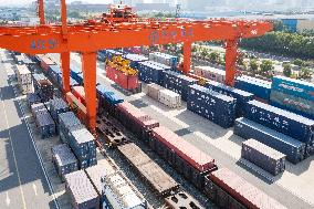 Workers Load Containers onto Vehicles in Nanjing