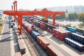 Workers Load Containers onto Vehicles in Nanjing