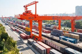 Workers Load Containers onto Vehicles in Nanjing