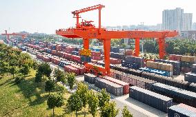 Workers Load Containers onto Vehicles in Nanjing