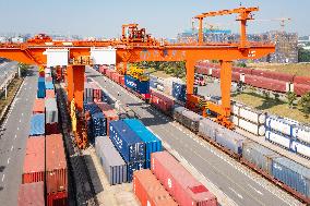 Workers Load Containers onto Vehicles in Nanjing