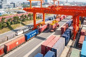 Workers Load Containers onto Vehicles in Nanjing