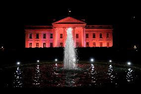 The White House is illuminated pink - Washington