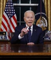 U.S. President Joe Biden delivers an address to the nation from the Oval Office of the White House in Washington