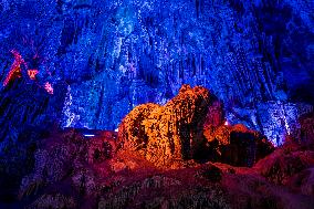 Tourists Travel The Reed Flute Cave Scenic Spot in Guilin