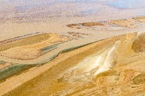 Yellow River Flowing Through Beach Trace