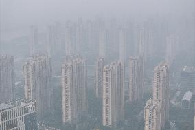 Buildings Loom Under Heavy Fog in Nanjing