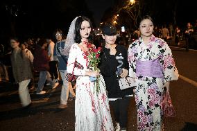 People in Various Halloween-themed Costumes Play in Shanghai