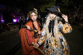 People in Various Halloween-themed Costumes Play in Shanghai