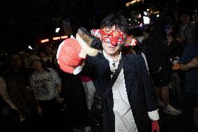 People in Various Halloween-themed Costumes Play in Shanghai