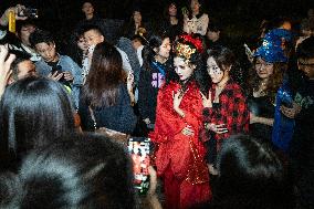 People in Various Halloween-themed Costumes Play in Shanghai