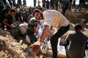 Grieving Palestinians at Al Aqsa Martyrs Hospital in Deir al-Balah Following Israeli Strikes