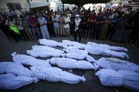 Grieving Palestinians at Al Aqsa Martyrs Hospital in Deir al-Balah Following Israeli Strikes