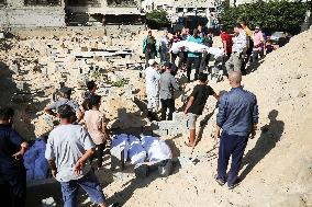 Grieving Palestinians at Al Aqsa Martyrs Hospital in Deir al-Balah Following Israeli Strikes