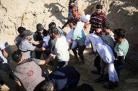 Grieving Palestinians at Al Aqsa Martyrs Hospital in Deir al-Balah Following Israeli Strikes