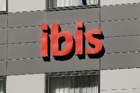 ibis hotel exterior, logo and signage