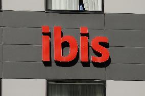 ibis hotel exterior, logo and signage