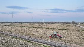 A Farm Machine Sows Wheat in A Field in Lianyungang