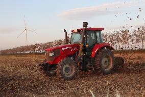 A Farm Machine Sows Wheat in A Field in Lianyungang