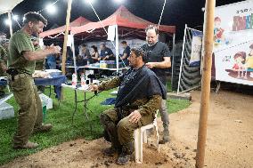 Israeli Soldiers Rest At A Camp Made by Volunteers