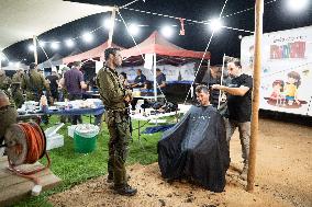 Israeli Soldiers Rest At A Camp Made by Volunteers