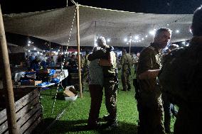 Israeli Soldiers Rest At A Camp Made by Volunteers