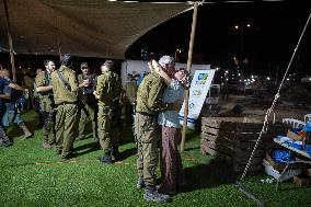 Israeli Soldiers Rest At A Camp Made by Volunteers