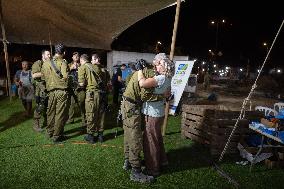 Israeli Soldiers Rest At A Camp Made by Volunteers