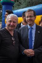 President Herzog Visits Evacuees In Jerusalem