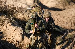 Servicemen Of The First Presidential National Guard Brigade Of Ukraine BUREVIY (Storm) During A Practical Exercise At A Training